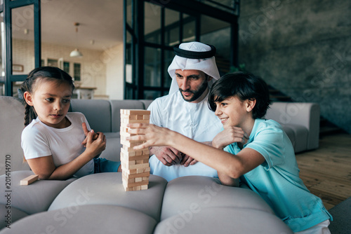 Traditional arabian family from Dubai spending time together at home