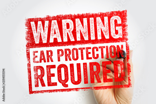 WARNING EAR PROTECTION REQUIRED text on stamp. Occupational health safety sign for high noise environments and hearing conservation. Hand holding marker with mandatory ppe requirement notice