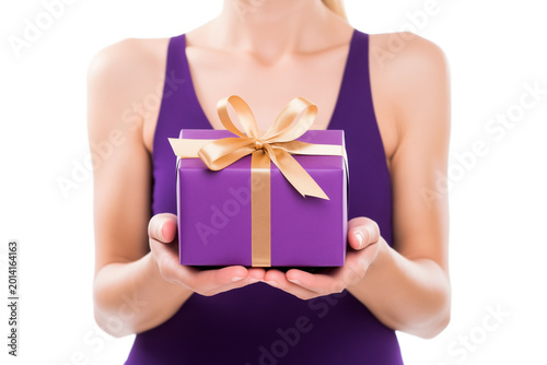 girl holding present purple gift box