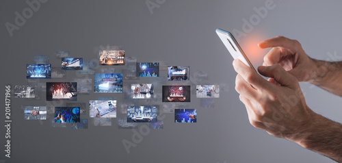 Konstfotografi Man holding smartphone with a digital pictures of business graphs