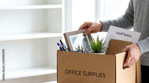 A person carrying a box labeled 