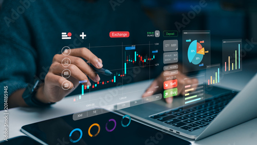 Foto Trader using a stylus pen with virtual holographic charts of stock market, forex and cryptocurrency for investment analysis, financial data and wealth management concept