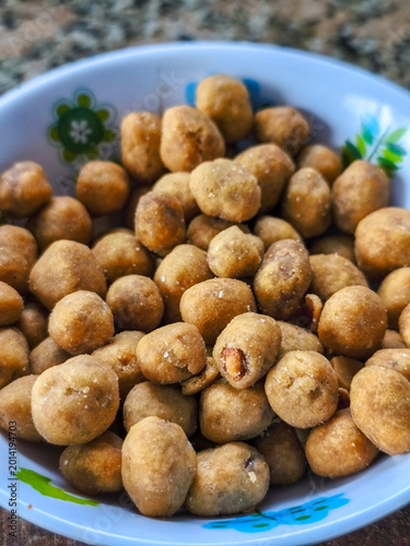 Close view of a small bowl with cracker nuts