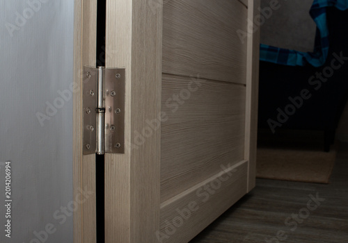Schilderij op canvas Door hinge mounted on wooden cabinet door during furniture installation