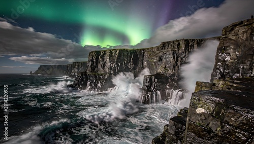 Dramatic Cliffside with Crashing Waves and Aurora Borealis Display at Night