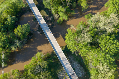 highway and bridge over Bourbeuse River in flooding stage, Missouri Ozarks near Rosebud, aerial view of springtime scenery