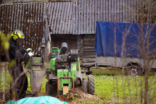 A stump grinder grinds, cuts, and digs up stumps.