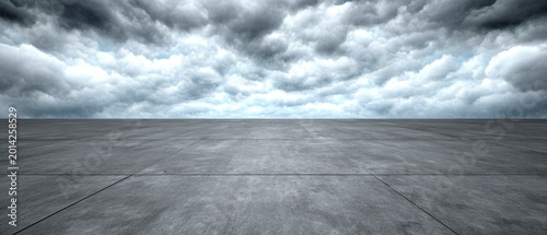 Empty Concrete Landscape Under Dramatic Overcast Sky with Gray Clouds and Horizon in Perspective