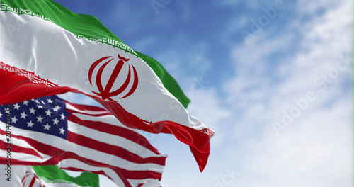 Cuadro en lienzo The national flags of Iran and the USA waving on a clear day