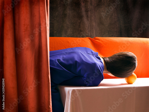 Scene of a woman in an interior behind a velvet curtain VI