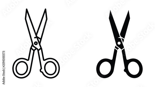Foto Two pairs of black and white scissors with open blades