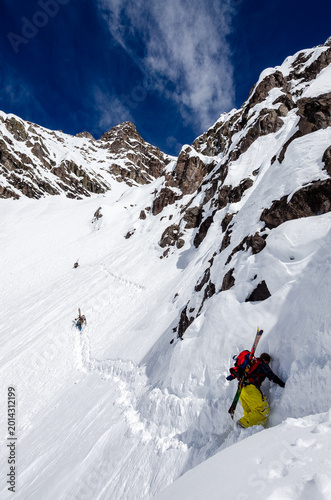 Canvas Print PORTILLO, CHILE – A skier navigates the steep, narrow Super C couloir at Portillo, one of the most challenging ski runs in the Andes, flanked by towering rock walls