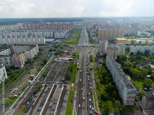Drone shot captured with DJI Mini 2 overlooking Montazhnikov Street (Ulitsa Montazhnikov) and its intersection with Shirotnaya Street in Tyumen, Russia. The photo shows a typical urban residential and