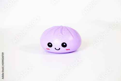 Fotografia Purple kawaii squishy dumpling antistress toy on white background