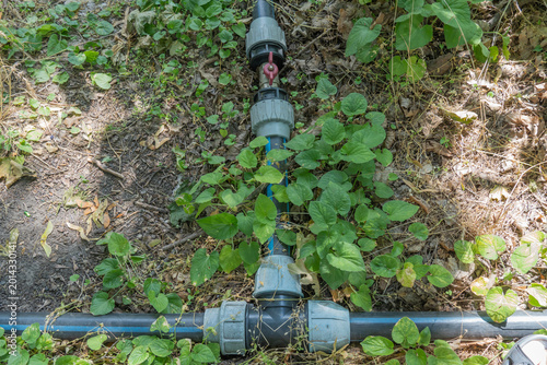 Fotografie Valve and connecting pipes of old automatic watering of equipment pipeline
