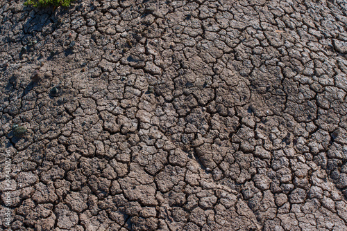 Fotografía Dry Cracked Earth Texture Background Highlighting Drought and Aridity