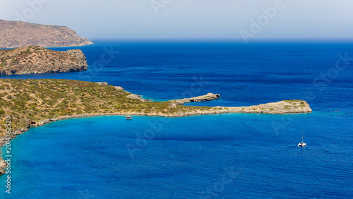 Fotografia Aerial view showing turquoise bay and rocky coastline of Crete, Greece