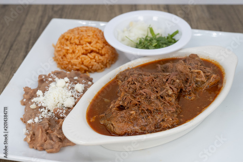 Canvas Print Hearty plate of birria smothered in consome, beans, and rice to satisfy that urg