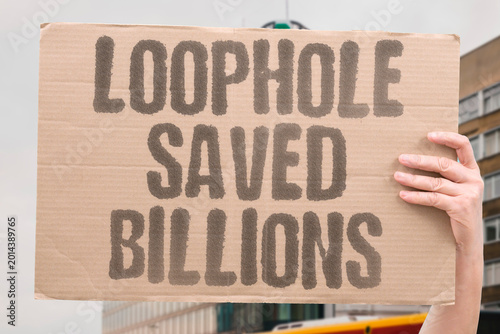Obraz na płótnie "Loophole Saved Billions" Legal tax loopholes allow billionaires to retain wealth otherwise owed publicly