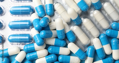 Tablou pe pânză Pile of many pills as background, top view