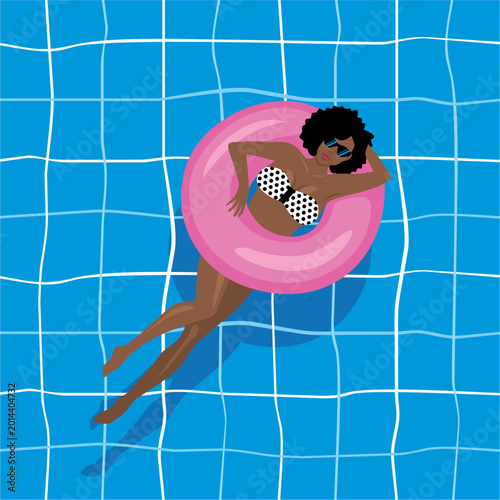 Woman relaxing on pink inflatable ring in swimming pool