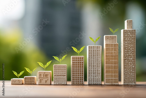 Growth of buildings shown with blocks and plants representing urban development and nature in a modern city setting