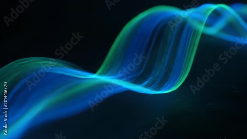 Abstract flowing blue and green light trails move gracefully across a dark background. This ethereal visual evokes a sense of motion and wonder.