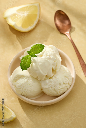 Lemon gelato ice cream with mint leaves in bowl