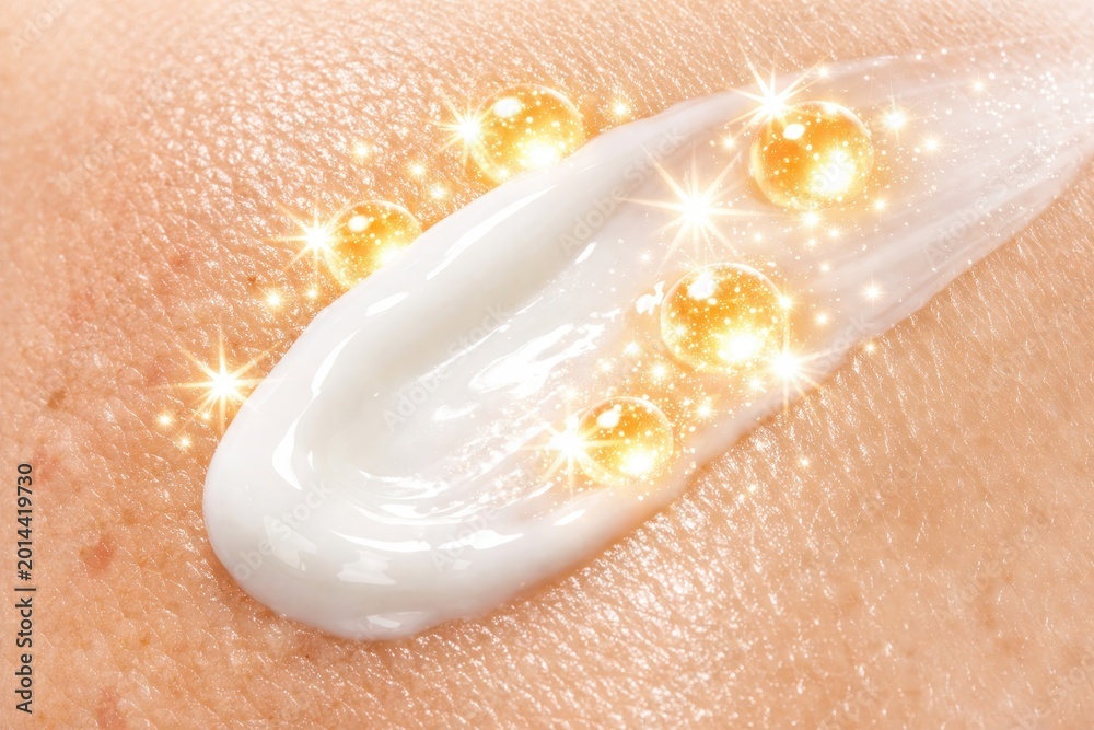 Fototapeta premium Cream applied on skin with glowing effects showing beauty and skincare routine