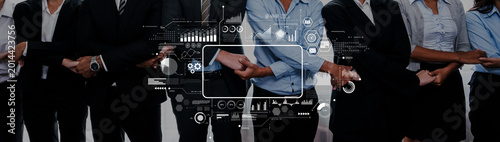 Fotografía A diverse group of professionals in business attire collaborates with a digital interface, symbolizing teamwork, innovation, and professional growth in a corporate environment