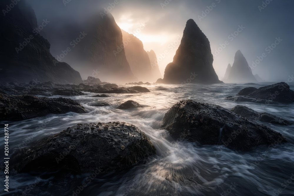 Fototapeta premium Dramatic Coastal Landscape with Sea Stacks, Waves and Mist