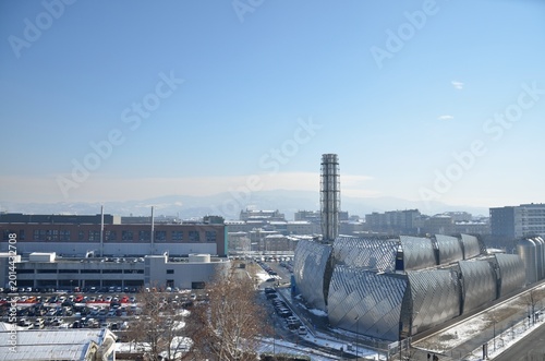 Modern Industrial Building in Turin Italy with Snowy Urban Landscape