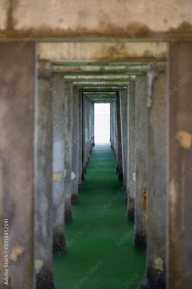 Fototapeta premium Under a concrete pier. Long exposure photography