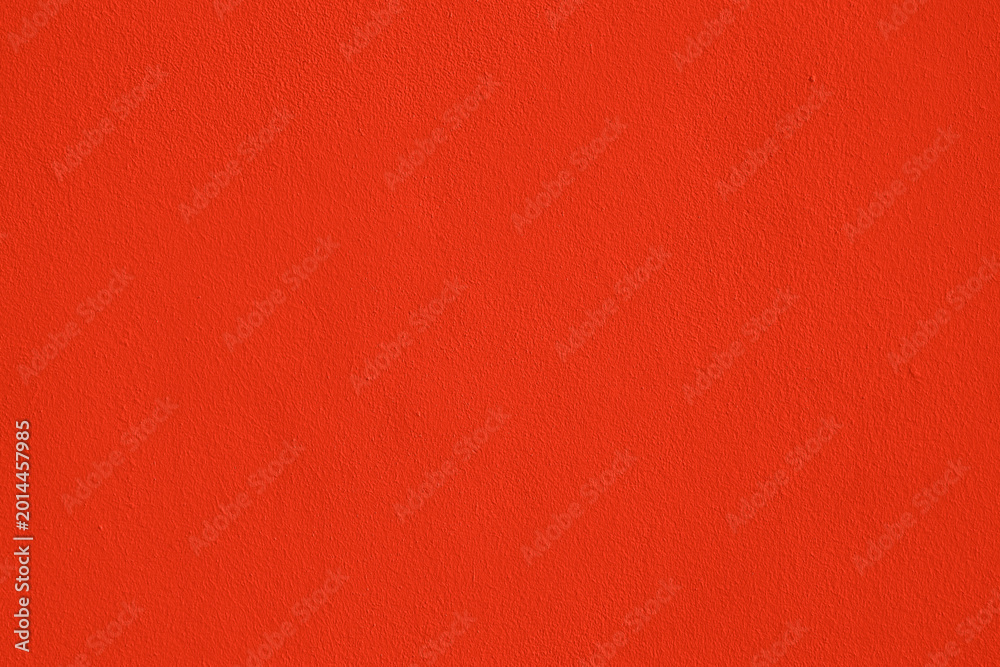 Fototapeta premium Background of natural red orange stucco in plaster cement texture lined pattern or stone in color Textured illuminated wall fence surface blend of warm sunny tones backdrop