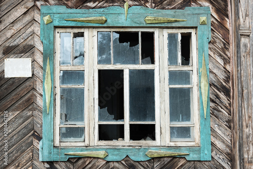 Photos Broken Window in an Abandoned Vintage Russian Wooden House