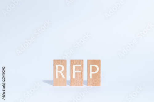 Eye-catching image of RFP text on wood blocks. The word stands for Request For Proposal.