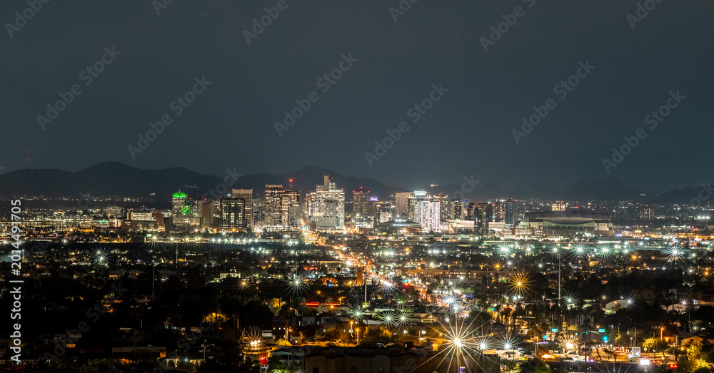 Fototapeta premium Phoenix Arizona Skyline at Night with Downtown City Lights and Urban Landscape Viewed from Elevated Perspective