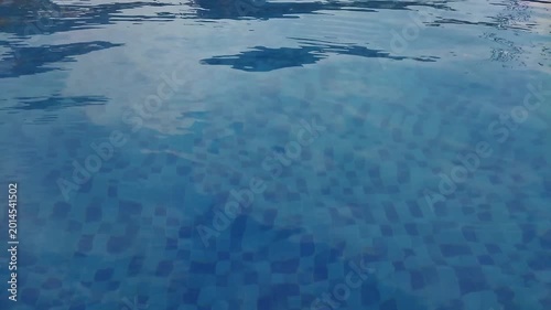 Relaxing Pool Surfaces With Gentle Ripples On Clear Blue Water