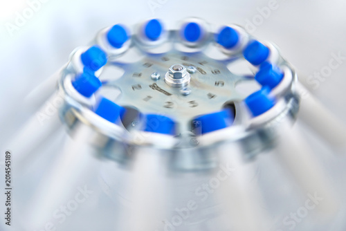 Photos Platelet-Rich plasma preparation. Tubes with blood in Centrifuge.