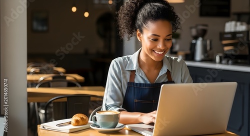 Smiling woman working on laptop in cozy coffee shop