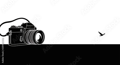 Bilde på lerret Silhouette of a camera and a flying bird against a stark black and white backgro