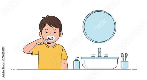 Little boy with brown hair wearing a yellow shirt and brushing his teeth in front of a white bathroom mirror and wash sink.