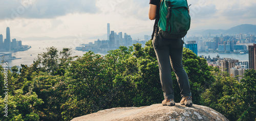 Photography Woman hiking on mountain top in Hong Kong