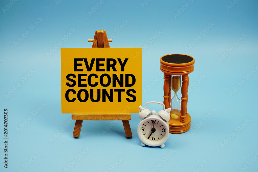 Fototapeta premium Every Second Counts text with alarm clock and hourglass on blue background