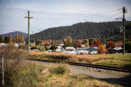 Scenic Town Surrounded By Colorful Autumn Foliage