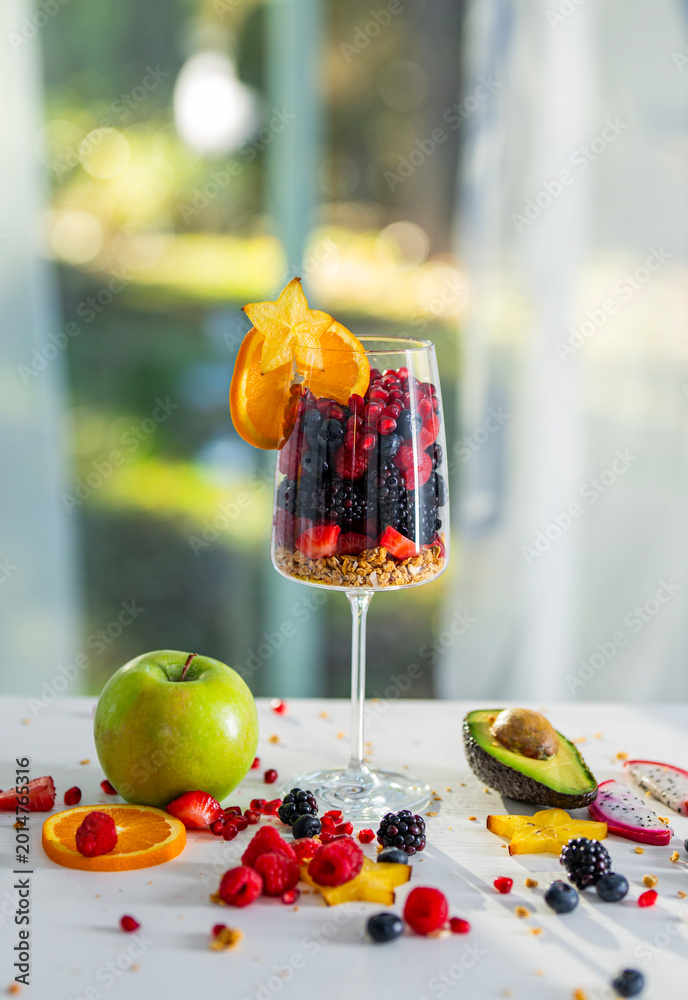 Fototapeta premium Organic Fruit Mix with Fruits and Berries. Fresh Summer Mix Fruits for Healthy Lifestyle and Detox. Balanced Fruits Diet.