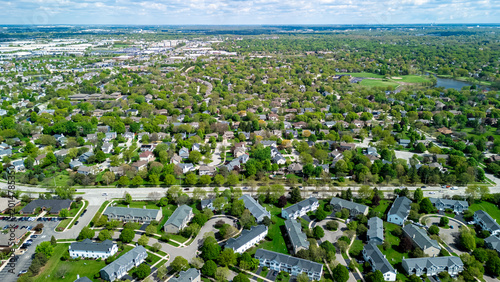 Above wide Aerial view of Real estate in American suburb at summer day. neighborhood view of residential houses .