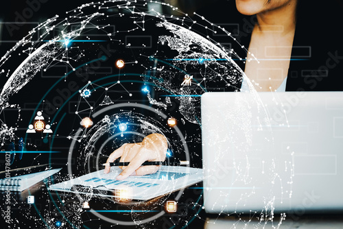 Cuadro en lienzo Investment concepts, businesswomen use document and computers to analyze stock markets, quantitative data collection, financial statement analysis, profitability through internet technology