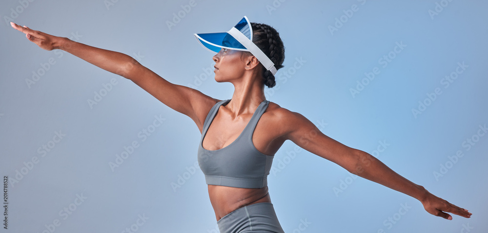 Obraz premium Health, stretching and banner with woman in studio for fitness, profile and workout development. Athlete, training and wellness challenge with female person and visor on white background for warm up