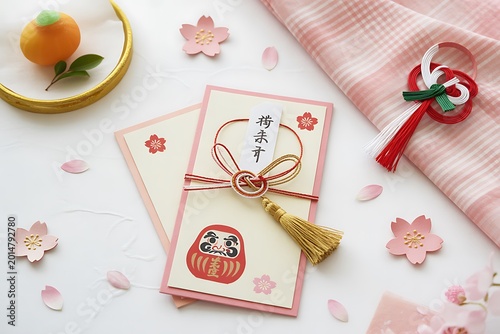New year otoshidama envelopes with decorations and a mandarin orange